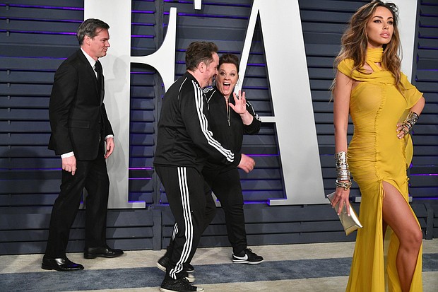 While most celebrities who attended the Oscars Sunday night slipped into their second look of the evening before hitting up the after-parties, Melissa McCarthy and her husband Ben Falcone had something else in mind. The couple turned up at Vanity Fair's bash wearing matching Adidas tracksuits.