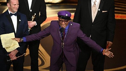 Spike Lee accepts the Oscar for adapted screenplay for “BlacKkKlansman.” (Kevin Winter / Getty Images)