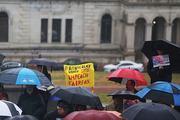 Protesters from around the state converge Saturday on the Capitol continuing their call for the resignation of Gov. Ralph S. Northam. One sign also called for Lt. Gov. Justin E. Fairfax’s impeachment.