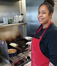 Tiara S. Smith prepares a chicken dish in the kitchen of Faith Community Baptist Church in the East End where she has run her lunch business and catering company, Drop Off Chef, since 2017.