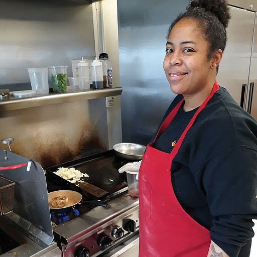 Tiara S. Smith prepares a chicken dish in the kitchen of Faith Community Baptist Church in the East End where she has run her lunch business and catering company, Drop Off Chef, since 2017.