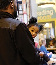 Music for the soul-
Youngsters from the Greater Richmond Children’s Choir perform songs celebrating the various seasons and holidays of the year during a concert last Saturday in the Gellman Room at the Richmond Public Library’s Main Branch in Downtown. Donte Beal and his 11-month-old daughter, Ashlynn, are ready for the music that Ashlynn’s older siblings were performing. The GRCC offers opportunities for youngsters ages 8 to 18 to study and perform choral music with other dedicated musicians. Registration is open for the 2019-2020 season. Details: GRCChoir.org or contact Anne Williford, GRCC executive director, at (804) 201-1894. (Sandra Sellars/Richmond Free Press)