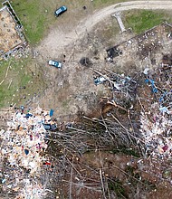 The deadly twister was upgraded Monday to an EF-4 tornado, leaving the small county bordering Georgia in tatters.