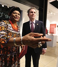 ‘Unbound 2019: Truth & Reconciliation’:
In one of his first public appearances since the blackface scandal, Gov. Ralph S. Northam, guided toward the artifacts by Delegate Delores L. McQuinn of Richmond, chair of the commission, attend the opening of “Unbound 2019: Truth & Reconciliation” on Feb. 28, at The Gallery at Main Street Station. This is the first part of a yearlong exhibition launched by the Richmond Slave Trail Commission to tell the stories of Africans in the Americas before 1619 through the present day. Located on the first floor, the exhibition is open to the public without charge 8 a.m. to 5 p.m. daily at the station, 1500 E. Main St. Under Gov. McDonnell’s administration, the state put up $11 million for various historical projects related to memorializing the enslaved in Virginia, including the Lumpkin’s Jail site and a related museum in Shockoe Bottom and funds for the improvement of the Richmond Slave Trail. (Regina H. Boone/Richmond Free Press)