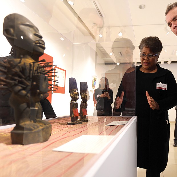 ‘Unbound 2019: Truth & Reconciliation’:
In one of his first public appearances since the blackface scandal, Gov. Ralph S. Northam attends the opening of “Unbound 2019: Truth & Reconciliation” on Feb. 28, at The Gallery at Main Street Station. This is the first part of a yearlong exhibition launched by the Richmond Slave Trail Commission to tell the stories of Africans in the Americas before 1619 through the present day. Mieko M. Timmons explains some of the exhibition pieces to Gov. Northam. Located on the first floor, the exhibition is open to the public without charge 8 a.m. to 5 p.m. daily at the station, 1500 E. Main St. Under Gov. McDonnell’s administration, the state put up $11 million for various historical projects related to memorializing the enslaved in Virginia, including the Lumpkin’s Jail site and a related museum in Shockoe Bottom and funds for the improvement of the Richmond Slave Trail. (Regina H. Boone/Richmond Free Press)
