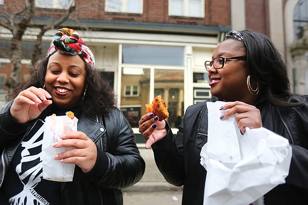 “Mobile Soul Sunday,” the kickoff of the 2019 Richmond Black Restaurant Week Experience which runs through Sunday, March 10, highlights Richmond’s black-owned restaurants, food truck and cart operators, caterers and local chefs. Kelli Hughes and Mica Younger enjoy steak egg rolls from RVA Steak. (Regina H. Boone/Richmond Free Press)