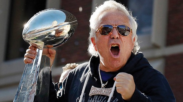 New England Patriots owner Robert Kraft yells to fans during the team's victory parade Feb. 5 throught downtown Boston to celebrate the Patriots' Super Bowl win over the Los Angeles Rams.