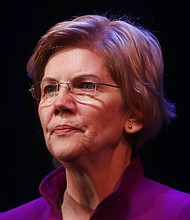 Sen. Elizabeth Warren on Friday declined to say whether she would support monetary compensation as a form of reparations for African-Americans whose ancestors were slaves.