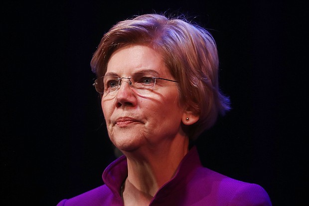 Sen. Elizabeth Warren on Friday declined to say whether she would support monetary compensation as a form of reparations for African-Americans whose ancestors were slaves.