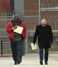 Singer R. Kelly left, walks with his attorney Steve Greenberg right, after being released from Cook County Jail, March 9, 2019, in Chicago.