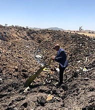 Ethiopian Airlines issued this image on their official facebook page. Pictured, the CEO visiting the crash site

Accident Bulletin no. 2
Issued on march 10, 2019 at 01:46 PM

Ethiopian Airlines Group CEO deeply regrets the fatal accident involved on ET 302 /March 10 on a scheduled flight from Addis Ababa to Nairobi.

The group CEO who is at the accident scene right now regrets to confirm that there are no survivors