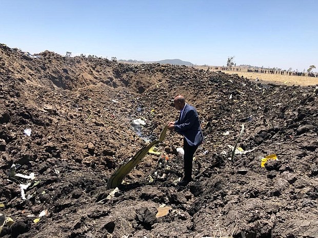 Ethiopian Airlines issued this image on their official facebook page. Pictured, the CEO visiting the crash site

Accident Bulletin no. 2
Issued on march 10, 2019 at 01:46 PM

Ethiopian Airlines Group CEO deeply regrets the fatal accident involved on ET 302 /March 10 on a scheduled flight from Addis Ababa to Nairobi.

The group CEO who is at the accident scene right now regrets to confirm that there are no survivors