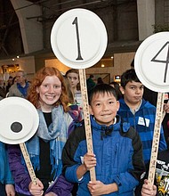 The Exploratorium in San Francisco hosts an annual parade on Pi Day, where people make number signs and march in order of pi's digits.