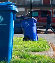 Blue recycling bins are seen on a residential street in Portland, Oregon. Coca-Cola will use learnings from its Atlanta program to help scale its recycling efforts.