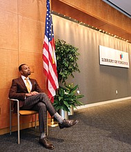 Confidently waiting: Columnist Zachary R. Woods, author of “Uncensored: My Life and Uncomfortable Conversations at the Intersection of Black  and White America,” listens as he is introduced as the first speaker of the 2019 Carole Weinstein Author Series at the Library of Virginia in Downtown on March 5. The next speaker in the free series is Khizr Khan, author of “An American Family: A Memoir of Hope and Sacrifice.” He will speak at 5:30 p.m. Thursday, April 4. Details: www.lva.virginia.gov. (Regina H. Boone/Richmond Free Press)