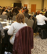 Focus on women’s health: Participants listen to keynote speaker Dr. Faye Belgrave, a health psychology professor and director of the Center for Cultural Experiences in Prevention at Virginia Commonwealth University during last Saturday’s Women’s Health Summit: A Holistic Approach to Women’s Health. The event, sponsored by the Richmond Metropolitan Area Chapter of the National Coalition of 100 Black Women, also featured a panel of women health professionals who addressed topics about mental health. Above, panelist Dr. Micah Allen, a naturopathic doctor and acupuncturist, talks with Demetria Davis and her 4-month-old, Kazi Taylor, during the summit. (Regina H. Boone/Richmond Free Press)