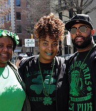 Wearing of the green:
From left, Erica Garnett and her sister-in-law and brother, Dashana and Earl Garnett, are decked out in green and shamrocks to celebrate St. Patrick’s Day during festivities last Saturday. Parties and special menus were featured at restaurants throughout the area, particularly on Sunday, March 17, which was St. Patrick’s Day. The trio was at 5th and Franklin streets in Downtown. (Sandra Sellars/Richmond Free Press)