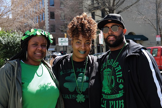 Wearing of the green:
From left, Erica Garnett and her sister-in-law and brother, Dashana and Earl Garnett, are decked out in green and shamrocks to celebrate St. Patrick’s Day during festivities last Saturday. Parties and special menus were featured at restaurants throughout the area, particularly on Sunday, March 17, which was St. Patrick’s Day. The trio was at 5th and Franklin streets in Downtown. (Sandra Sellars/Richmond Free Press)
