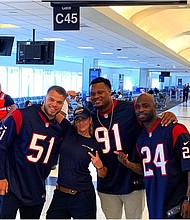 Texans players surprise United Airlines customers and employees in the terminal at George Bush International Airport