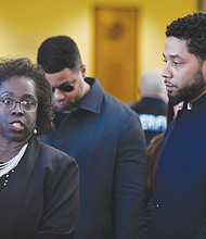 Jussie Smollett, right, stands beside his attorney, Patricia Brown Holmes, at a press conference in Chicago after prosecutors on Tuesday dropped felony charges accusing him of faking a racist, anti-gay attack on himself. The “Empire” star agreed to do community service and let the city keep his $10,000 bail exchange for the deal.