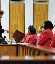 City Councilwoman Ellen F. Robertson, 6th District, left, presents President Connie Cuffee and members of Delta Sigma Theta Sorority’s Richmond Alumnae Chapter with a certificate of recognition honoring Ms. Height at Monday night’s City Council meeting.