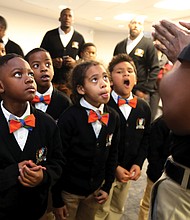 Launching into the future: George Mason Elementary School students look up with excitement at Amos Miles, an education specialist with the Science Museum of Virginia, during the launch of the Brothers United mentoring program. Richmond Public Schools launched the initiative Saturday to pair African-American children with African-American male mentors. Officials hope to expand the pilot program in the future to all city schools. (Regina H. Boone/Richmond Free Press)