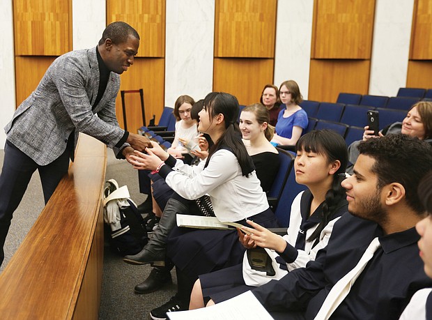 Japan ‘Sister City’ recognition: Richmond Mayor Levar M. Stoney greets several students from Saitama, Japan, last week during their visit to City Council chambers to recognize the 20th anniversary of Saitama’s partnership with Richmond in the Sister City program. The high school students and two teachers from Urawa Municipal High School spent a week in the Richmond area through the scholastic exchange program. The students visited the Virginia Museum of Fine Arts and Maymont, where there was a welcome ceremony in the Japanese Gardens. Saitama and four other cities in Mali, Namibia, China and England have Sister City relationships with Richmond. (Regina H. Boone/Richmond Free Press)