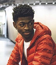 Atlanta's Lil Nas X has had a viral hit with the song "Old Town Road," which Billboard has reportedly pulled from its country music charts.
