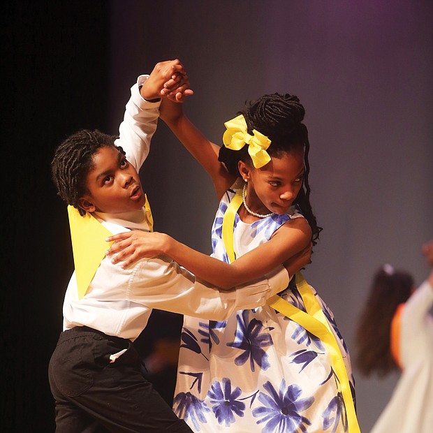 Tango togetherness: D’andre Morris, left, and Aaliya Thornhill showcase their tango moves to impress judges at a ballroom dance competition March 28 at Huguenot High School. The two fifth-graders from Overby-Sheppard Elementary were among the young people who participated in the event that Dancing Classrooms of Greater Richmond hosted. The nonprofit organization, which promotes ballroom dancing in city schools as a way to instill discipline, courtesy, teamwork and other values, provided the schoolchildren with 10 weeks of instruction before the event. (Regina H. Boone/Richmond Free Press)