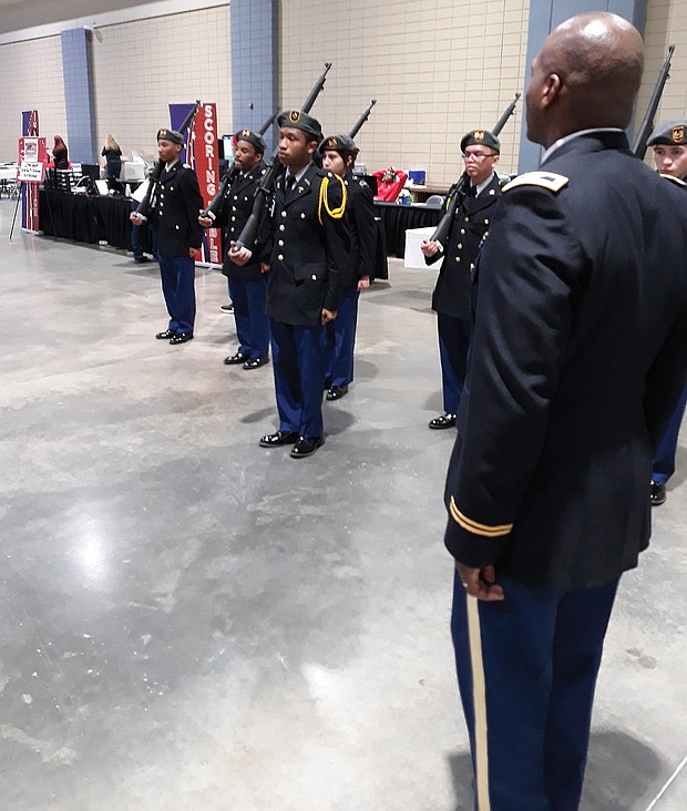 Drill ready: Army Col. Alexander Taylor observes as Cadet 2nd Lt. Taire Hubbard leads Huguenot High School’s Junior ROTC team in a practice Saturday before the Richmond team faced judges in the U.S. Army Junior ROTC Drill Championship. Location: Greater Richmond Convention Center in Downtown. The team that Col. Taylor instructs was one of 103 high school units that came from as far away as Hawaii and Oregon to take part in the daylong event in Richmond. More than 2,500 teens showcased their military abilities at the event. Richmond beat out six other cities to host the championship for the first time. Army officials said they hope to return next year. (Jeremy M. Lazarus/Richmond Free Press)