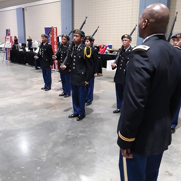 Drill ready: Army Col. Alexander Taylor observes as Cadet 2nd Lt. Taire Hubbard leads Huguenot High School’s Junior ROTC team in a practice Saturday before the Richmond team faced judges in the U.S. Army Junior ROTC Drill Championship. Location: Greater Richmond Convention Center in Downtown. The team that Col. Taylor instructs was one of 103 high school units that came from as far away as Hawaii and Oregon to take part in the daylong event in Richmond. More than 2,500 teens showcased their military abilities at the event. Richmond beat out six other cities to host the championship for the first time. Army officials said they hope to return next year. (Jeremy M. Lazarus/Richmond Free Press)