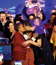 Chicago Mayor-elect Lori Lightfoot, left, kisses her wife, Amy Eshlemen, during her victory celebration Tuesday night after defeating challenger Toni Preckwinkle to become the first African-American woman and openly gay mayor of the city.