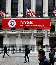 A Pinterest banner hangs on the facade of the New York Stock Exchange during the morning rush in February 2018. Pinterest is expected to go public later this month.
