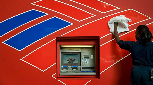 Bank of America is raising its minimum pay to $20 an hour for its more than 205,000 employees.