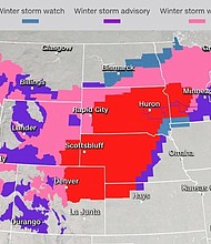 Storm warnings and blizzard conditions extended to at least 12 states, the National Weather Service said. Officials urged drivers to be cautious, with states such as South Dakota warning people in some counties to stay off the roads completely.