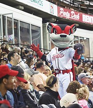 The Richmond Flying Squirrels mascot, Nutzy, works the crowd during last Saturday’s doubleheader at The Diamond. The Flying Squirrels opened the season last Thursday with a sold out crowd of 9,845 fans. Last Friday’s game was canceled because of the weather, resulting in the doubleheader on Saturday.