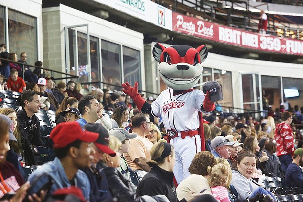 The Richmond Flying Squirrels mascot, Nutzy, works the crowd during last Saturday’s doubleheader at The Diamond. The Flying Squirrels opened the season last Thursday with a sold out crowd of 9,845 fans. Last Friday’s game was canceled because of the weather, resulting in the doubleheader on Saturday.