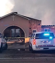 Law enforcement remains at the scene of the fire that destroyed Greater Union Baptist Church in Opelousas, La.