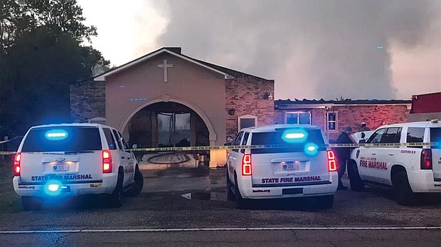 Law enforcement remains at the scene of the fire that destroyed Greater Union Baptist Church in Opelousas, La.