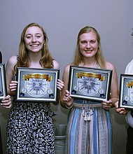 Dr. Felecia Friend-Harris, president of the Virginia Area Chapter of Pi Lambda Theta, an education honor society and professional association, congratulates the organization’s book and scholarship award winners. The honorees are, from left, Maeve Hall of Monacan High School, who will be attending the University of Richmond; April Zoppa of Thomas Dale High School, who will attend James Madison University; Laney Hausler of Manchester High School, who will attend the College of William & Mary; and Brian Cruz-Lovo of James River High School, who will attend Virginia Commonwealth University. (Rudolph Powell)