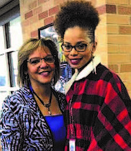Congresswoman Robin Kelly (left) with Golden Apple Award recipient Catherine Ross-Cook, who teaches English literature and composition at the school.