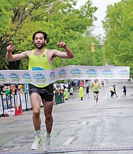 More than 25,000 runners and walkers turned out last Saturday for the annual Monument Avenue 10K. Philo Germano, 23, of Charlottesville is the first to cross the finish line in the main 10K race in 29 minutes, 34 seconds, while, Bethany Sachtleben, 27, of Fairfax wins the women’s race in 32:39. Both won $2,000 for first place finishes. (Sandra Sellars/Richmond Free Press)