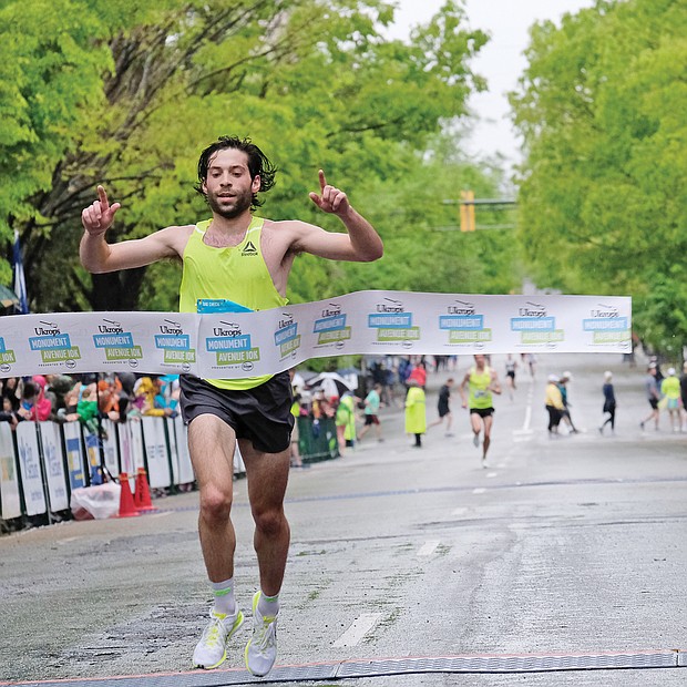 More than 25,000 runners and walkers turned out last Saturday for the annual Monument Avenue 10K. Philo Germano, 23, of Charlottesville is the first to cross the finish line in the main 10K race in 29 minutes, 34 seconds, while, Bethany Sachtleben, 27, of Fairfax wins the women’s race in 32:39. Both won $2,000 for first place finishes. (Sandra Sellars/Richmond Free Press)
