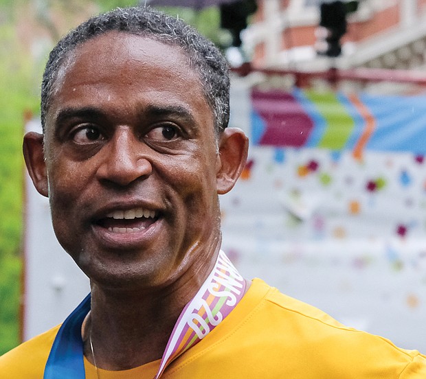 Virginia Commonwealth University marketing professor Brian Brown bathes in the victory of beating elite runners to the finish line and winning the “Dash for Cash” last Saturday in the annual Monument Avenue 10K.