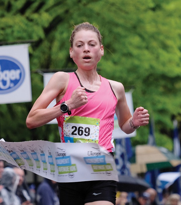 More than 25,000 runners and walkers turned out last Saturday for the annual Monument Avenue 10K.  Philo Germano, 23, of Charlottesville is the first to cross the finish line in the main 10K race in 29 minutes, 34 seconds, while, Bethany Sachtleben, 27, of Fairfax wins the women’s race in 32:39. Both won $2,000 for first place finishes. (Sandra Sellars/Richmond Free Press)