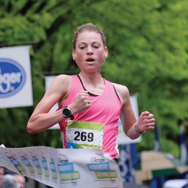 More than 25,000 runners and walkers turned out last Saturday for the annual Monument Avenue 10K.  Philo Germano, 23, of Charlottesville is the first to cross the finish line in the main 10K race in 29 minutes, 34 seconds, while, Bethany Sachtleben, 27, of Fairfax wins the women’s race in 32:39. Both won $2,000 for first place finishes. (Sandra Sellars/Richmond Free Press)