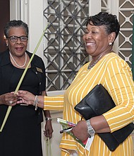Palm Sunday: Leola Hill, left, lead usher at St. Paul’s Baptist Church Belt Boulevard campus in South Side, hands Edna Austin a palm at the 10 a.m. worship service April 14 on Palm Sunday. The Christian feast day, held the Sunday before Easter, commemorates Jesus’ entry into Jerusalem just days before his crucifixion and resurrection. According to the Gospels, Jesus rode into Jerusalem on a donkey, where people celebrating him as the son of God laid palm fronds, small branches and clothing in his path. (Ava Reaves)