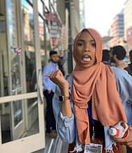 Shaymaa Ismaa'eel was attending a conference of the Islamic Circle of North America in Washington DC on Sunday when she saw a group of protesters holding signs against the Muslim faith and the Prophet Muhammad.