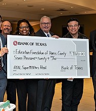 Bank of Texas donates check and books to Harris County Department of Education Head Start. (left) Chris Frey, assistant vice president, commercial banking, Bank of Texas; Gary Whitt, senior vice president, commercial banking, Bank of Texas; Venetia Peacock, senior director, Harris County Department of Education Head Start; Steve Bradshaw, CEO, BOK Financial; Armando Rodriguez, community partnerships manager, HCDE Head Start; and Randy Walker, market CEO, Bank of Texas