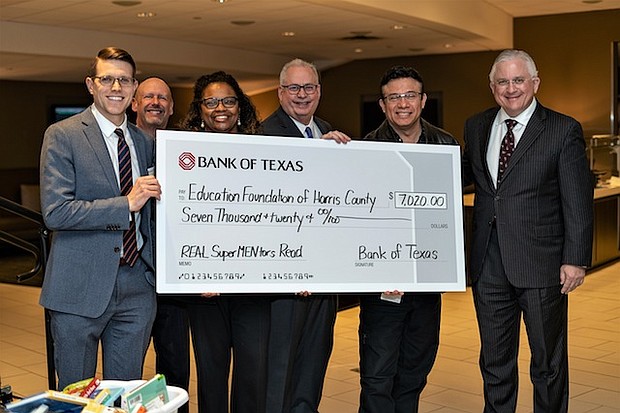 Bank of Texas donates check and books to Harris County Department of Education Head Start. (left) Chris Frey, assistant vice president, commercial banking, Bank of Texas; Gary Whitt, senior vice president, commercial banking, Bank of Texas; Venetia Peacock, senior director, Harris County Department of Education Head Start; Steve Bradshaw, CEO, BOK Financial; Armando Rodriguez, community partnerships manager, HCDE Head Start; and Randy Walker, market CEO, Bank of Texas